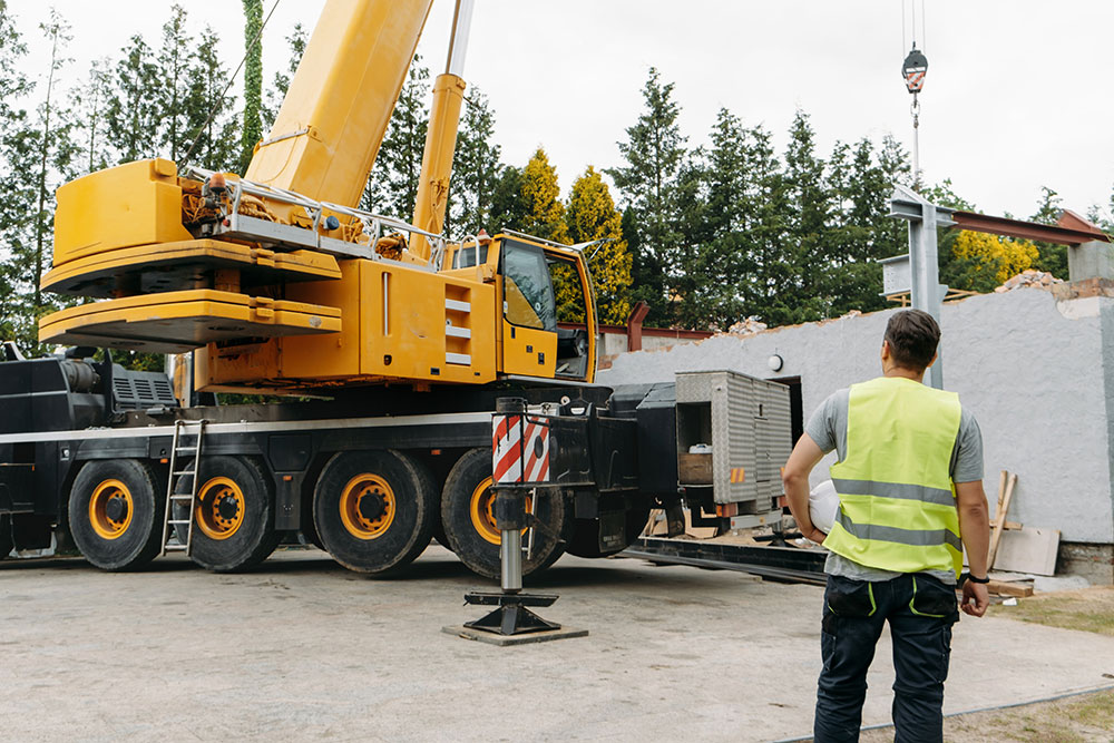 Construction worker checking the crane