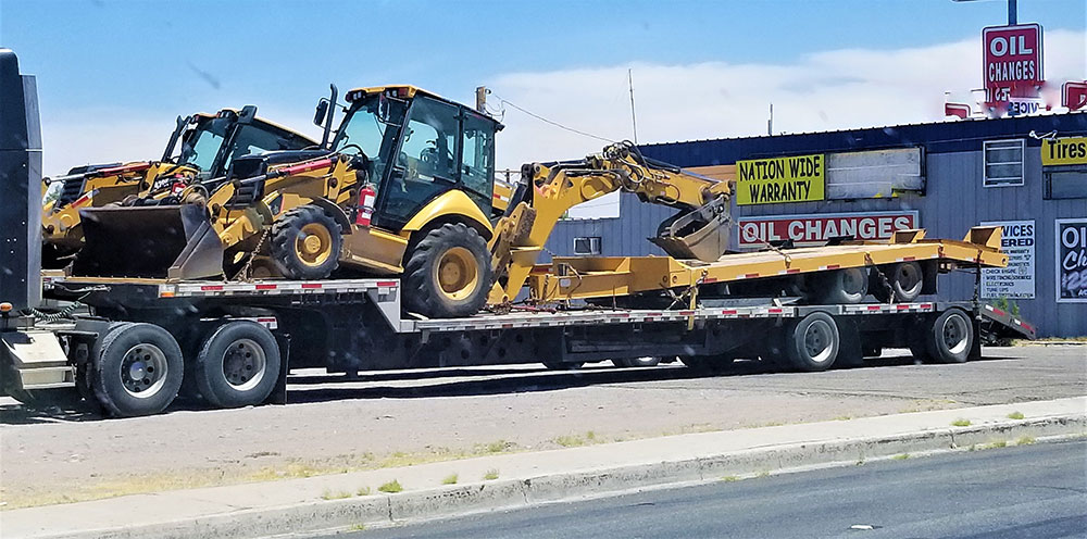Heavy Construction Vehicles Being Hauled